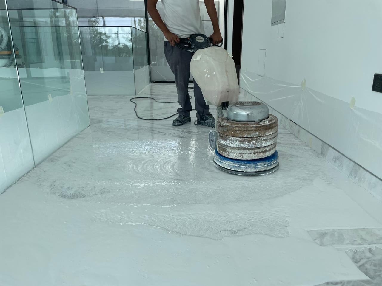 technician-grinding-floor-with-commercial-machine